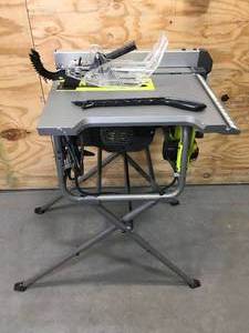 lot 67 image: RYOBI RTS12 15 Amp 10 in. Compact Portable Corded Jobsite Table Saw with Folding Stand - C229