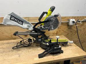 lot 210 image: RYOBI TSS702 10 Amp Corded 7-14 in. Compound Sliding Miter Saw C219