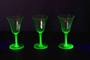 lot 70 image: Three Uranium Glass Champagne Glasses