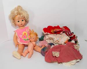 lot 59 image: 1969 Baby Sing Along Mattel Doll and Clothes