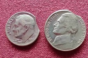 lot 23 image: (2) 1960s Clipped Die Error Coins
