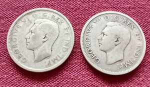 lot 91 image: (2) Canadian Silver Quarters