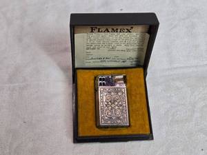 lot 27 image: Vintage FLAMEX Butane Lighter with Intricate Design