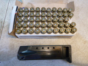 lot 23 image: 49 Rounds of Ammo and 9mm Clip
