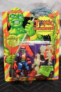 lot 19 image: Vintage Toxic Crusaders Bonehead Action Figure with Glow-in-the-Dark Weapons