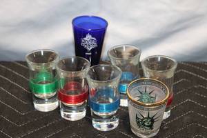 lot 72 image: Set of 7 Assorted Shot Glasses Featuring House of Blues and Liberty