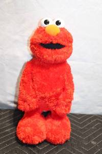 lot 112 image: Red Plush Elmo Toy with Battery Compartment