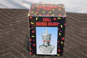 lot 129 image: Skull Incense Holder with Red Glass Eyes