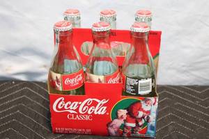 lot 154 image: Vintage 1995 Coca-Cola Christmas Glass Bottles Set of 6