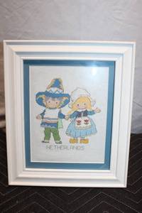 lot 168 image: Framed Netherlands Cross-Stitch Art with White Border