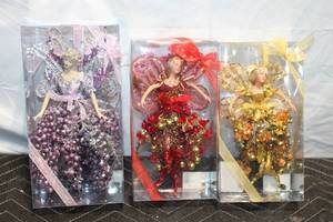 lot 278 image: Set of 3 Glittery Fairy Ornaments in Red, Purple, and Gold