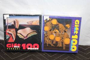 lot 389 image: Set of 2 Sealed 100-Piece Gift Box Jigsaw Puzzles - The Lantern Bearers and Salvador Deli