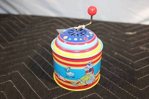 lot 474 image: Colorful Vintage Tin Hand Crank Musical Toy
