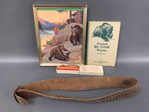 lot 38J image: Vintage Hunting Collectibles Framed Art, Book, Deer Call, Sling