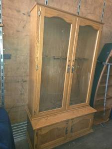 lot 13 image: Oak Wood Gun Cabinet with Glass Doors - Still Looking for Key