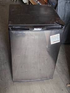 lot 15 image: Haier Compact Mini Refrigerator with Glass Shelves