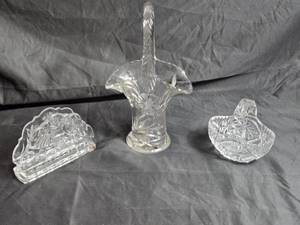 lot 77 image: Decorative Cut Glass Items Includes a large basket, a napkin holder, and a small basket