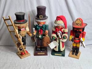 lot 127 image: 4 Wooden Nutcrackers - Ebenezer Scrooge, Mrs. Santa Claus, a firefighter, and a chimney sweep