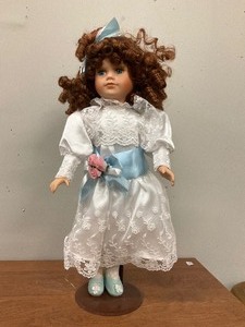 lot 15 image: Porcelian Doll on Stand