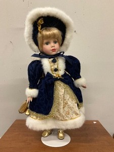 lot 16 image: Porcelian Doll on Stand