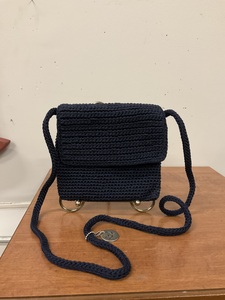 lot 83 image: Navy blue Sak brand purse.