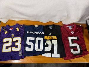 lot 122 image: Collection of 4 NFL Team Jerseys Including Vikings, Broncos, Packers, and 49ers