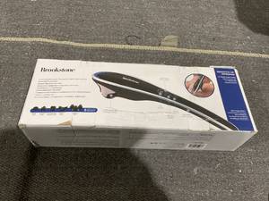 lot 174 image: Brookstone Handheld Percussion Body Massager, 4 Vibration Modes, 5 Interchangeable Heads, Black