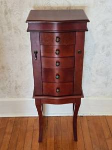 lot 14 image: Elegant Wooden Jewelry Armoire with Mirror and Drawers