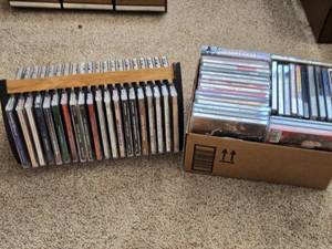 lot 37 image: Mixed Music CDs with Holder and Cardboard Box