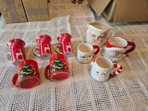 lot 56 image: Holiday and Christmas Themed Mugs and Creamers, Santa Mugs