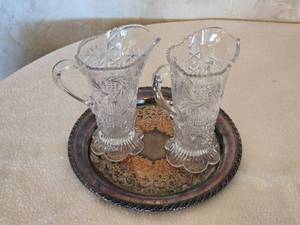 lot 104 image: Pair of Vintage Crystal Pitchers (One Marked Hartman Feather Your Nest) with Ornate Metal Tray