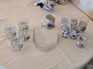 lot 208 image: Christmas-Themed Glassware Set with Mugs, Plates, and Tumblers