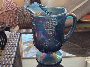 lot 218 image: Vintage Blue Carnival Glass Pitcher with Grapes and Vine Design
