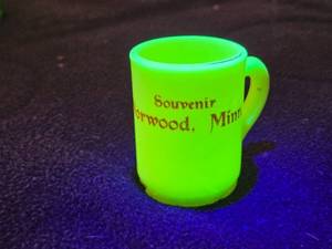 lot 224 image: Vintage Uranium Glass Souvenir Mug from Norwood, Minn.