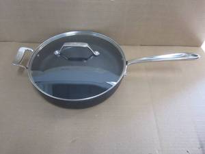 lot 129 image: All-Clad HA1 Hard Anodized Nonstick Saut Pan 4 Quart Induction Oven Broiler Safe 500F Pots and Pans, Cookware Black - Scratches on Pan and Small Dents on Lid.