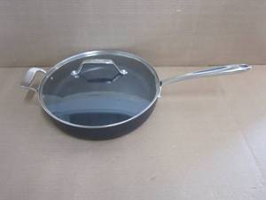 lot 130 image: All-Clad HA1 Hard Anodized Nonstick Saut Pan 4 Quart Induction Oven Broiler Safe 500F Pots and Pans, Cookware Black - Scratches on Pan and Small Dents on Lid.