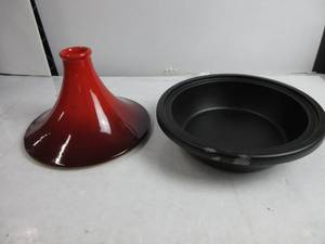 lot 24 image: Le Creuset Enameled Cast Iron Moroccan Tagine, 2.5 qt., Cerise NEW BUT DAMAGED AROUND RIM