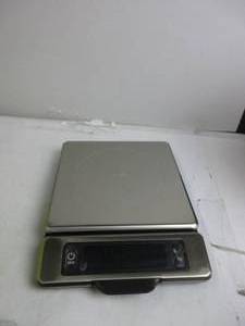 lot 86 image: OXO Good Grips 11-Pound Stainless Steel Food Scale with Pull-Out Display USED, STAINED BY BUTTON, TESTED, WORKS