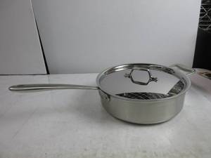 lot 94 image: All-Clad Brushed Stainless Steel Pan with lid, 5 quart, Silver HAS SCRATCHES ON LID, BOTTOM, AND RIM, SLIGHTLY USED