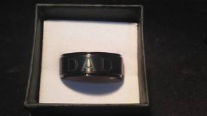 lot 438 image: Black Engraved DAD Ring.