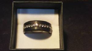 lot 439 image: Black Ring with Embedded Gem.