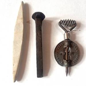 lot 81 image: Cast Iron Stove Damper, Railroad Spike and German Whetstone