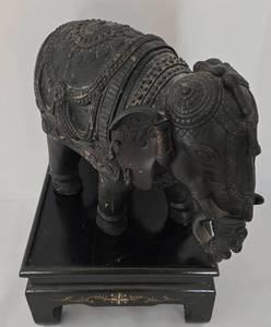lot 37 image: Stylized Composite Elephant and Wooden Display Stand