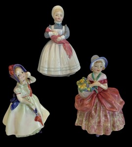lot 237 image: Royal Doulton Cassie, The Rag Doll and Babie Figurines