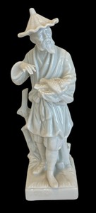 lot 242 image: Fitz & Floyd Oriental Man with Basket of Fish Figurine
