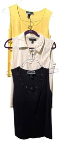 lot 407 image: Three Sleeveless Size Medium Shirts by Karen Scott