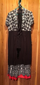 lot 82 image: Two Black Dresses with White Patterns by AGB Dress and Amanda Lane