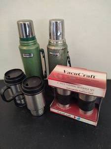 lot 129 image: Vintage Stanley Thermos and Various Thermal Coffee Mugs