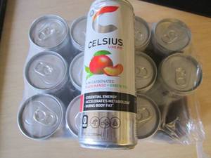 lot 147 image: 12 pack Celsius Peach mango Green T...