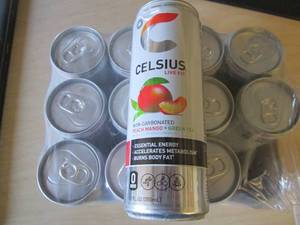 lot 149 image: 12 pack Celsius Peach mango Green T...
